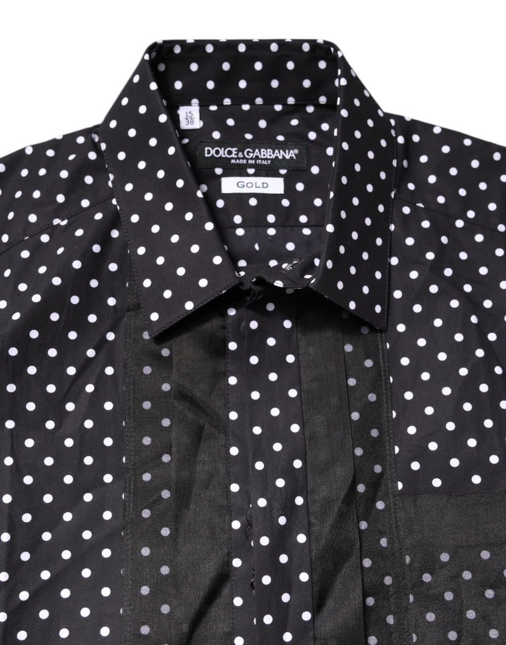 Chemise formelle noire à pois blancs et manches longues de Dolce & Gabbana, avec détails dorés.
