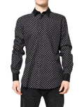 Chemise formelle en coton noir à pois Dolce & Gabbana, avec col classique et boutons sur le devant.