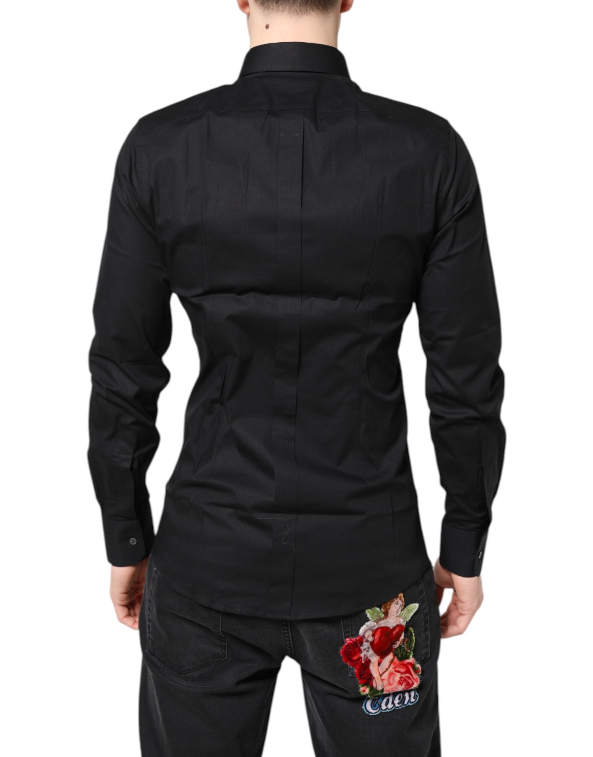 Chemise longue noire en coton Dolce & Gabbana avec détails dorés sur les manches longues, élégante pour homme ou femme.