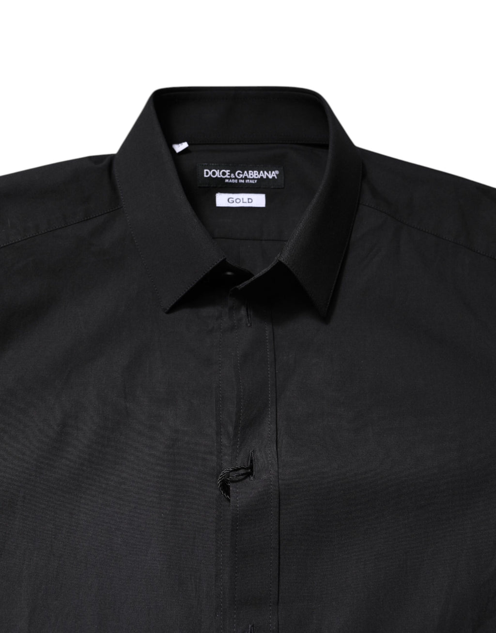 Chemise formelle Dolce & Gabbana noire en coton avec détails dorés, élégante et sophistiquée, visible sur le produit.
