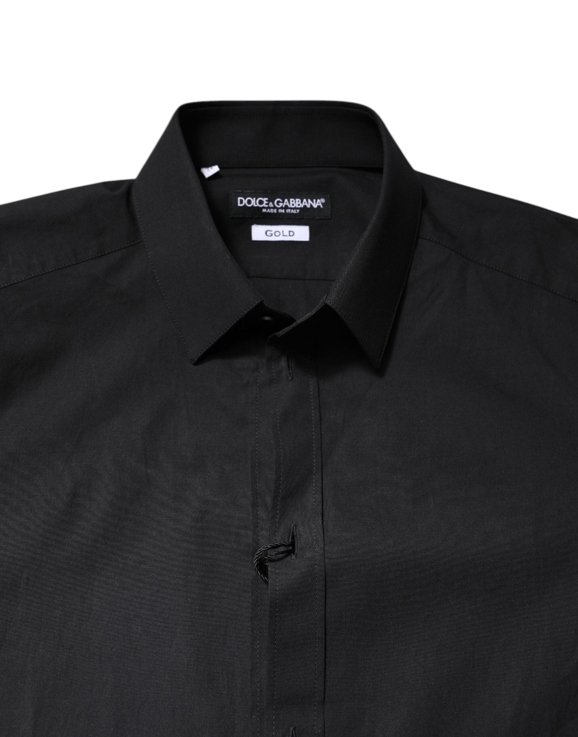 Chemise formelle Dolce & Gabbana noire en coton avec détails dorés, élégante et sophistiquée, visible sur le produit.