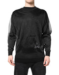 Pull-over noir en maille Dolce & Gabbana avec logo, col rond et style décontracté, visible en détail dans l'image.