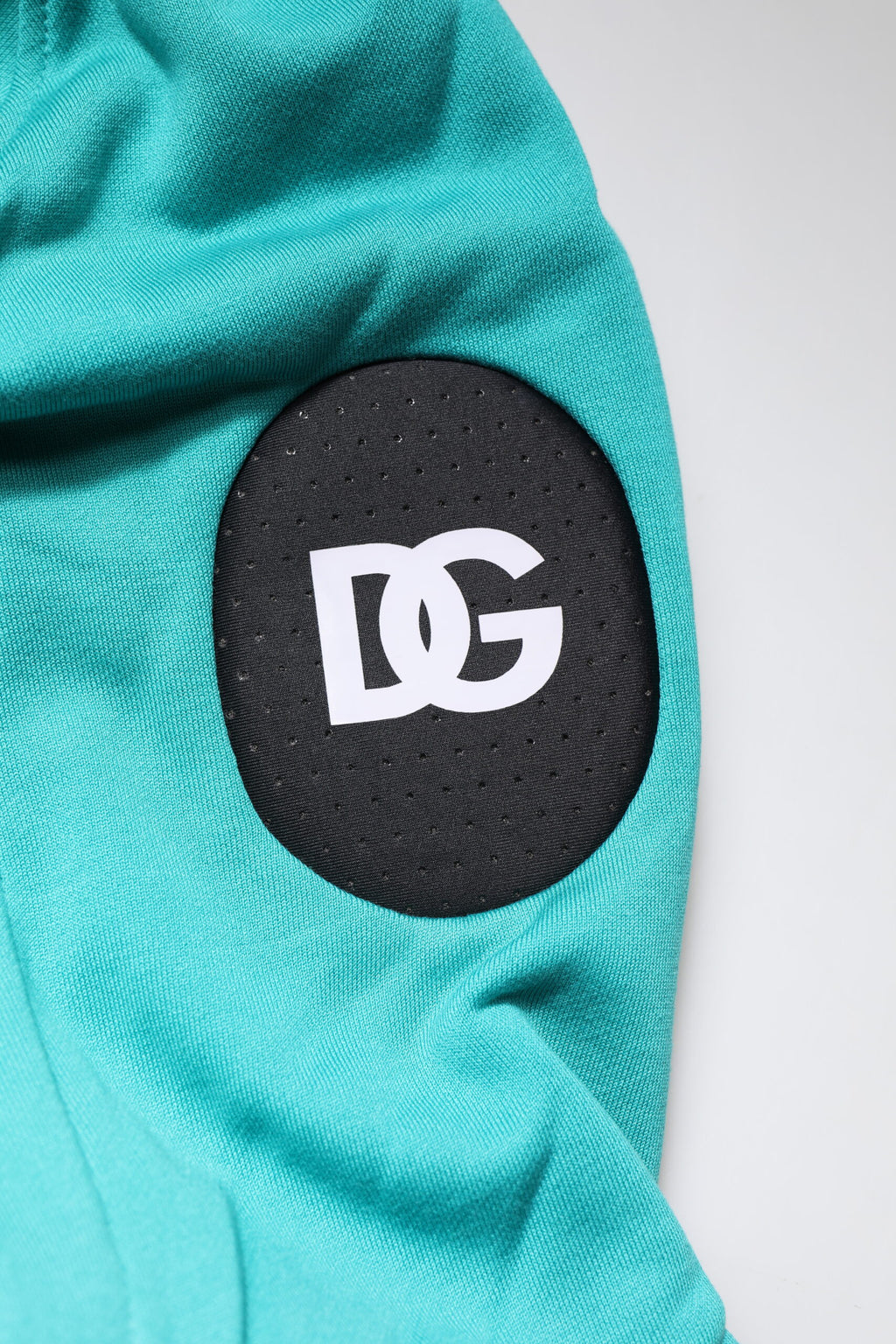 Gilet de sport pour homme Dolce & Gabbana en coton vert avec capuche, veste décontractée et confortable.