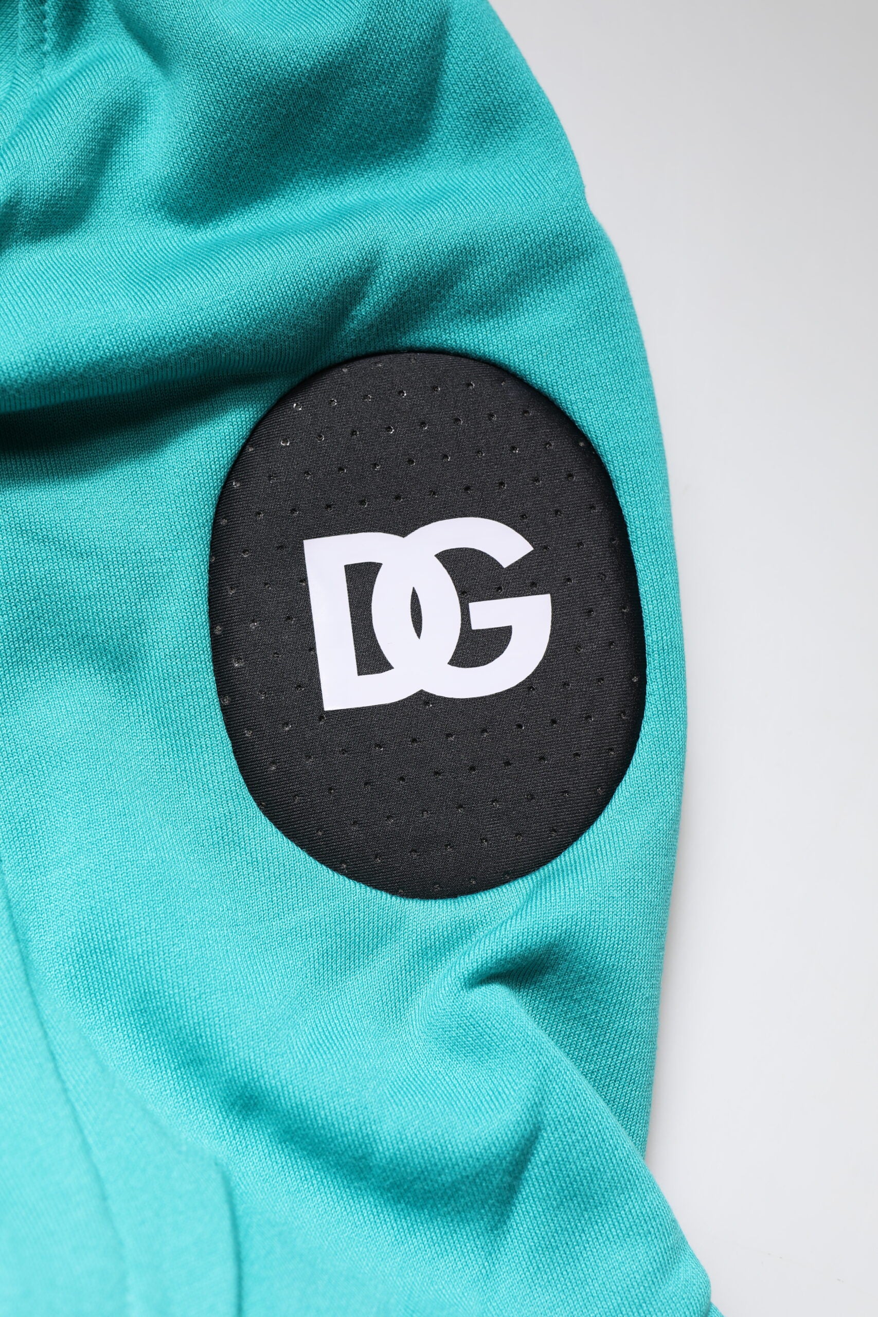 Gilet de sport pour homme Dolce & Gabbana en coton vert avec capuche, veste décontractée et confortable.