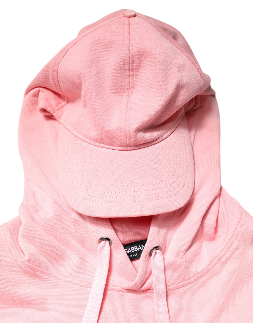 Gilet homme Dolce & Gabbana en coton rose avec capuche, vêtement de sport et pull léger, porté sur un mannequin.