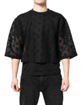 T-shirt noir Dolce & Gabbana à manches courtes, logo transparent, style décontracté, vue du devant avec détails du tissu.