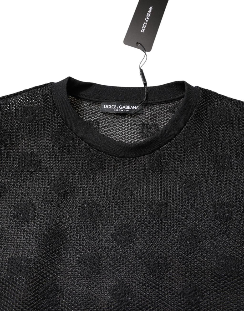 T-shirt noir Dolce & Gabbana à manches courtes en tissu transparent avec logo visible, élégante et tendance.