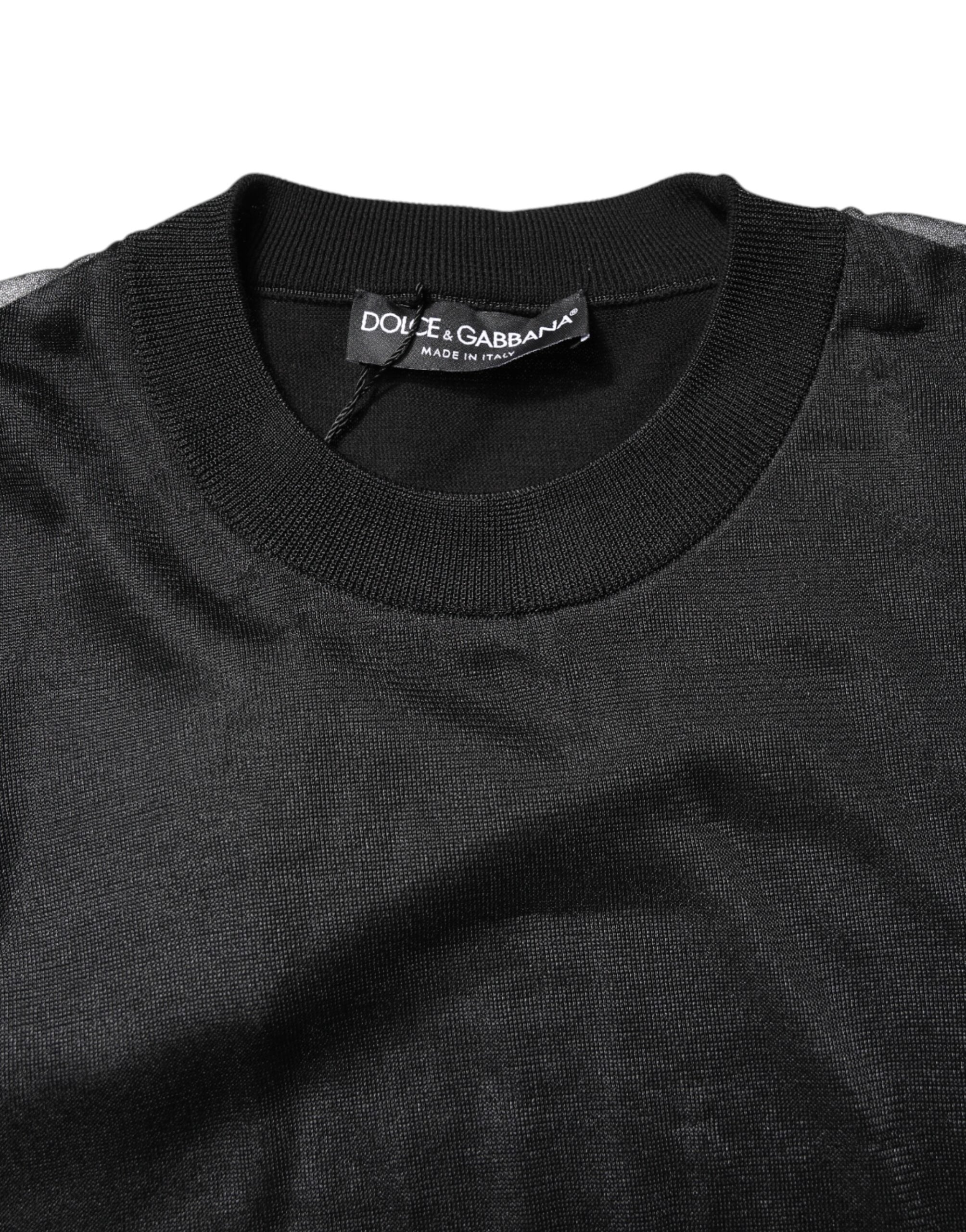 Pull noir en tricot avec logo Dolce & Gabbana, col rond et style décontracté, visible sur le pull porté.
