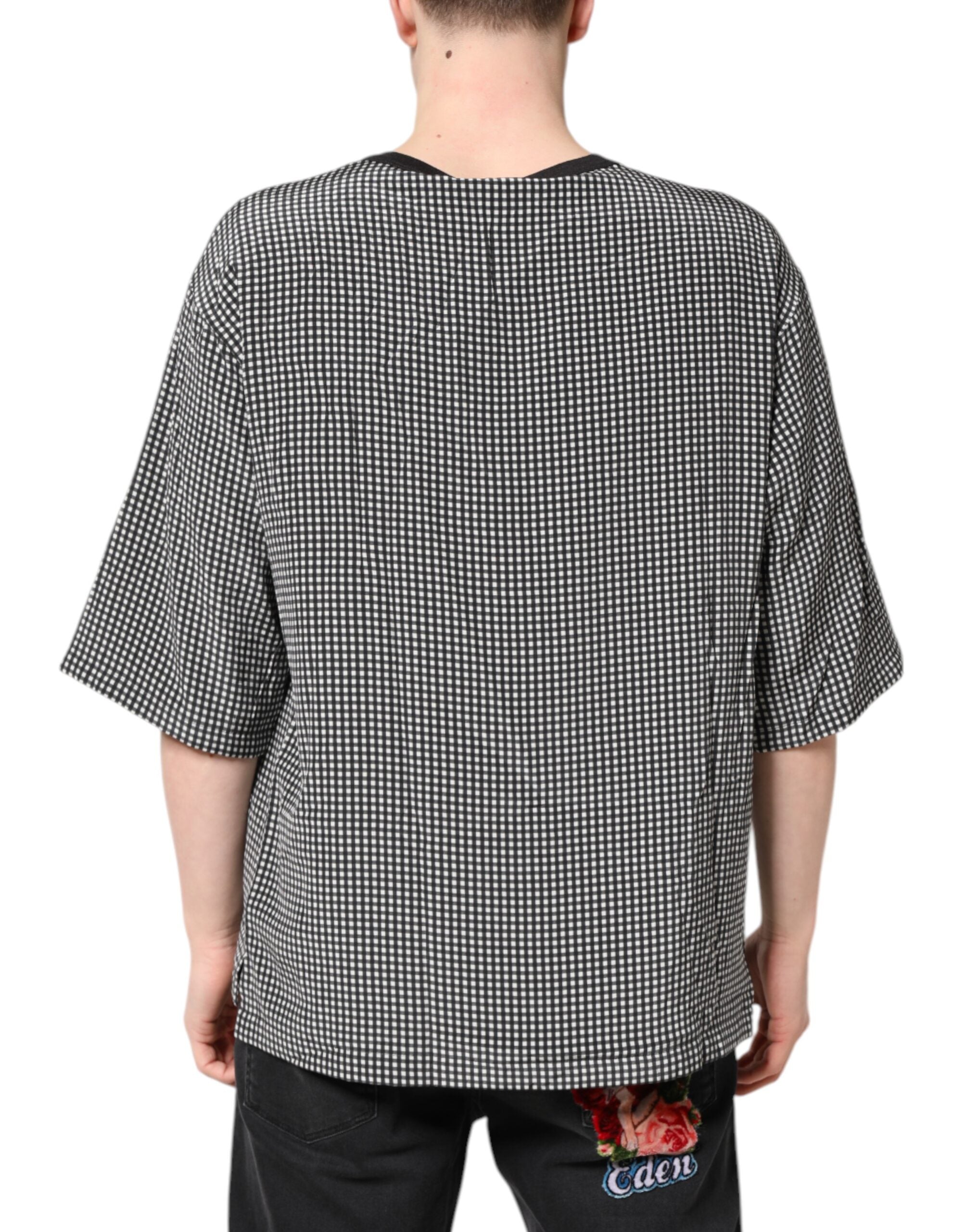 T-shirt à manches courtes Dolce & Gabbana noir avec imprimé graphique distinctif, en coton pour un style moderne et élégant.