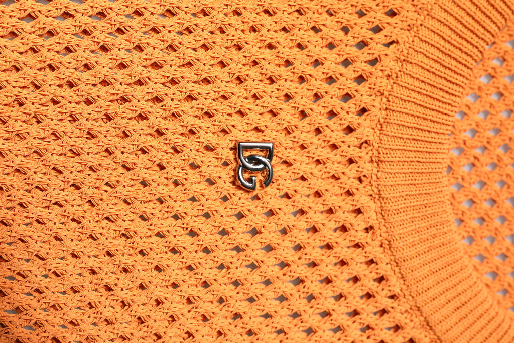T-shirt sans manches en cachemire orange Dolce & Gabbana à col rond, mode élégante et confortable.