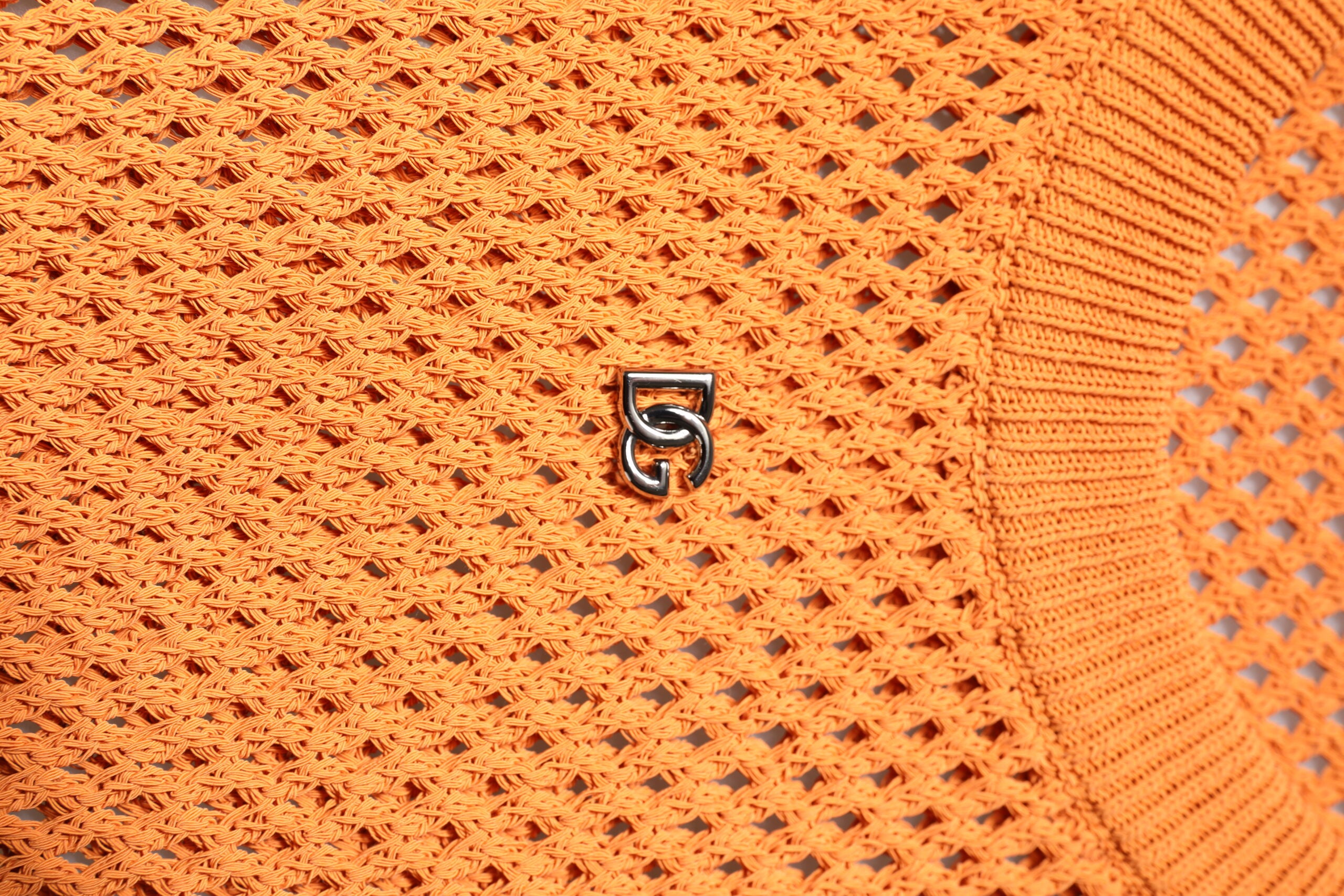 T-shirt sans manches en cachemire orange Dolce & Gabbana à col rond, mode élégante et confortable.