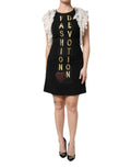 Robe courte noire Dolce & Gabbana Fashion Devotion avec embellissements, style élégant et détails sophistiqués, vue de face.