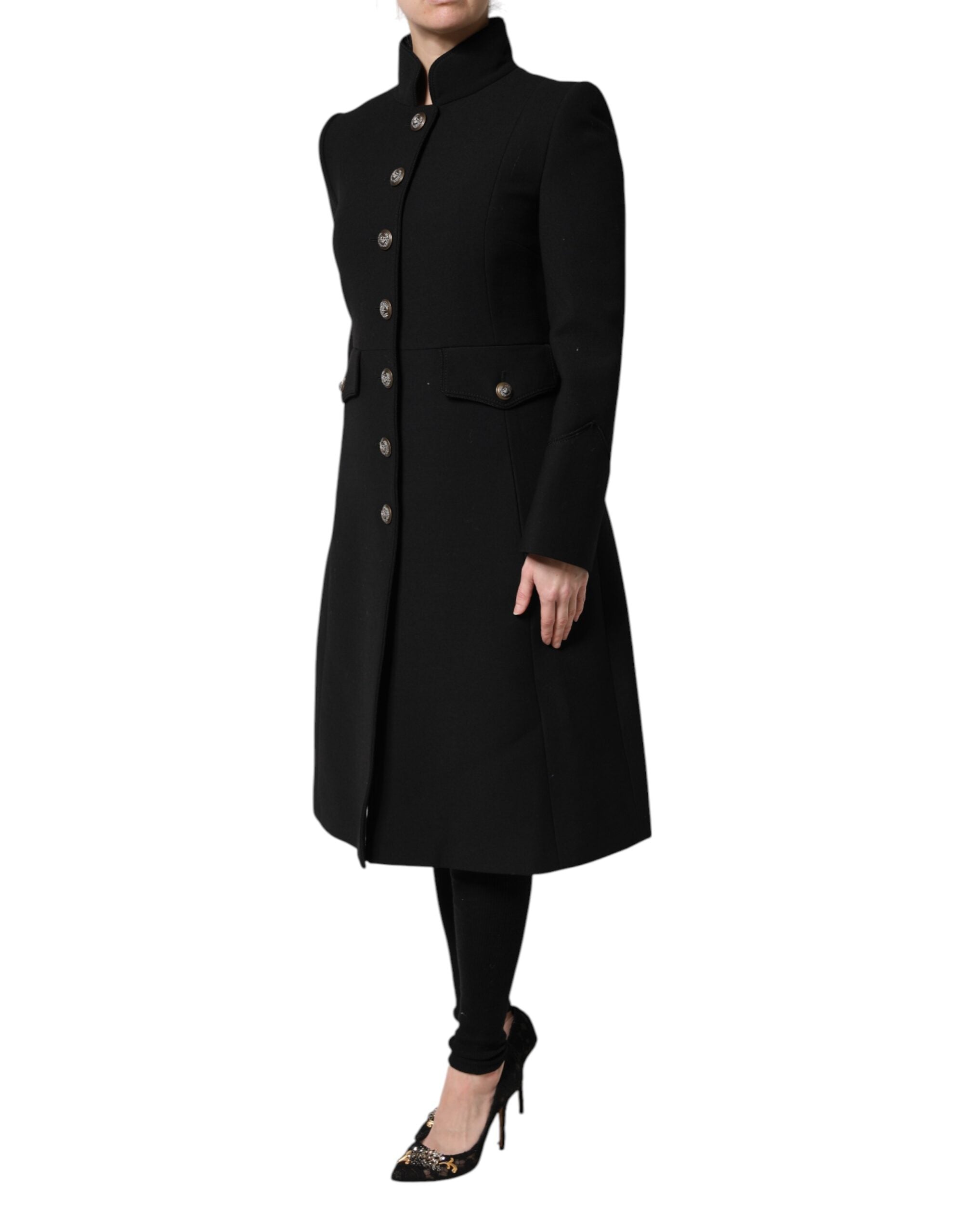 Manteau trench en laine noire à un seul boutonnage de Dolce & Gabbana, veste élégante avec col classique et ceinture ajustable.