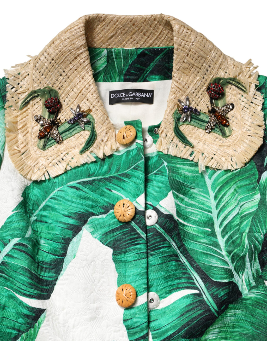 Imperméable trenchcoat Dolce & Gabbana à motif multicolore de feuilles avec embellissements, style élégant et tendance.