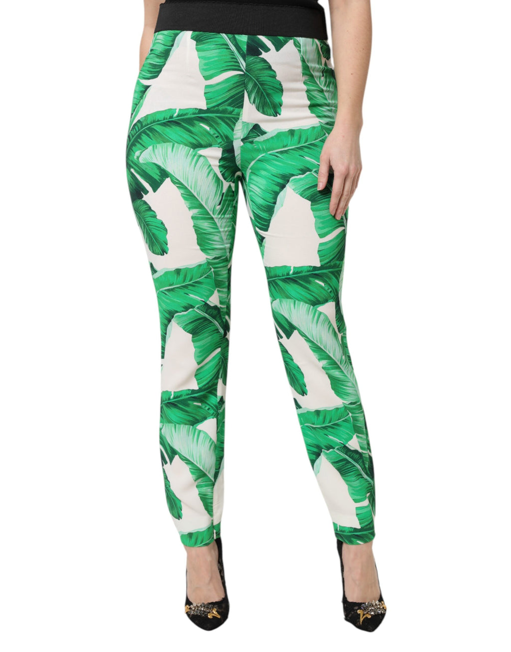 Pantalons taille haute Dolce & Gabbana blancs avec motif de feuilles vertes, mode élégante et tendance.