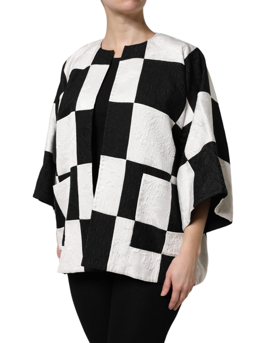 Blazer Dolce & Gabbana en jacquard patchwork blanc et noir, veste élégante avec motif sophistiqué, vue de face.