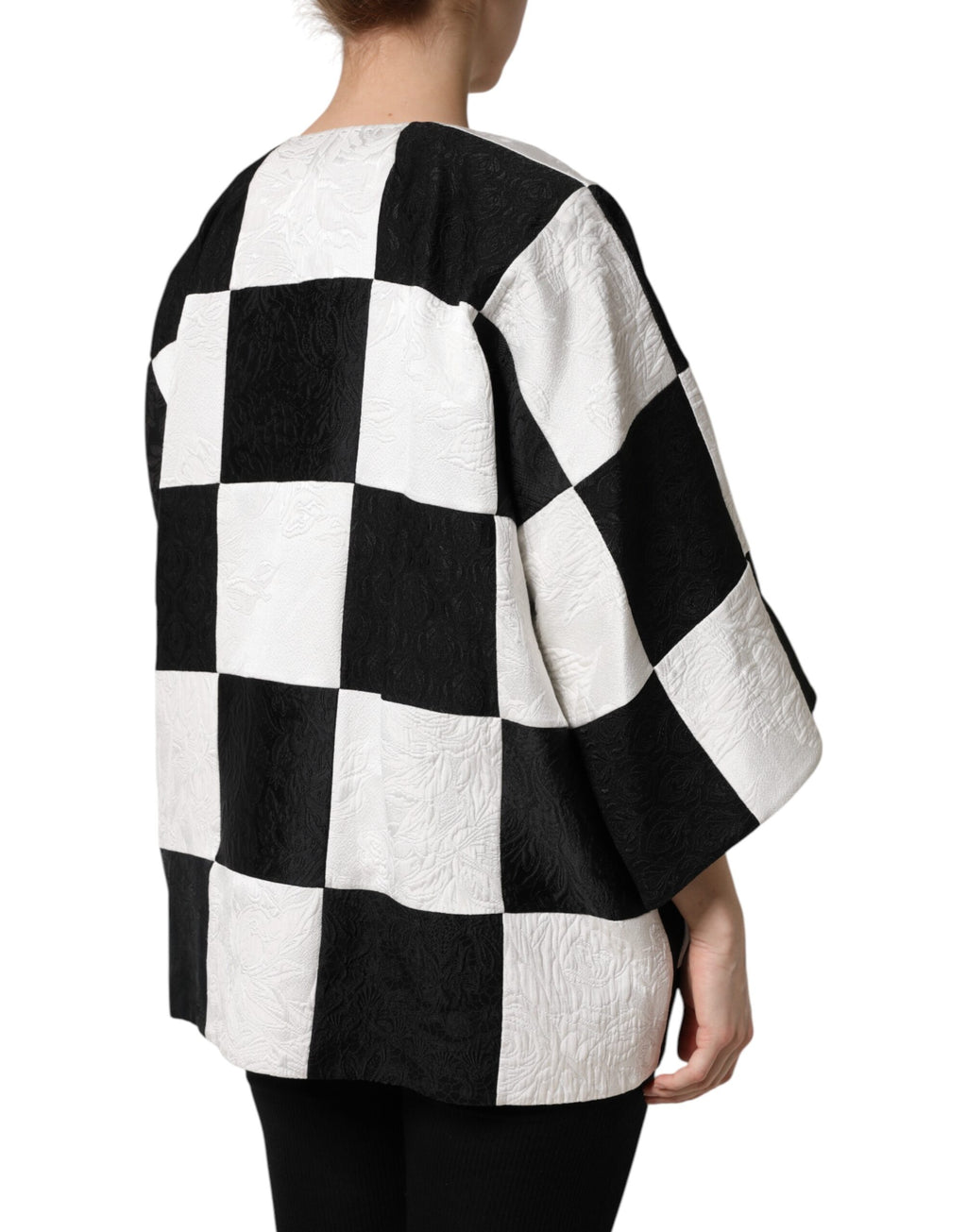 Veste blazer Dolce & Gabbana en jacquard blanc et noir avec patchwork, élégante et sophistiquée, vue de face.