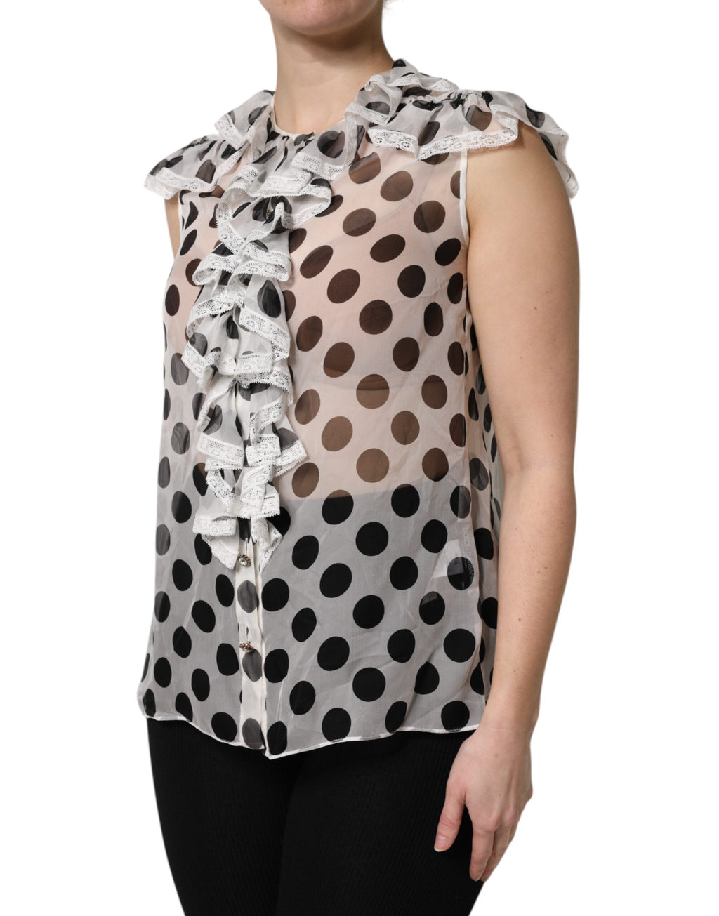 Haut sans manches en coton blanc et noir à pois de Dolce & Gabbana, style élégant et confortable, visible dans l'image.
