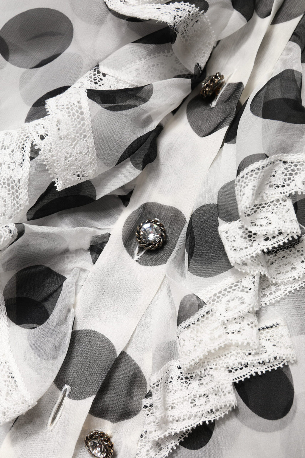 Haut sans manches en coton noir et blanc à pois de Dolce & Gabbana, style élégant et léger.
