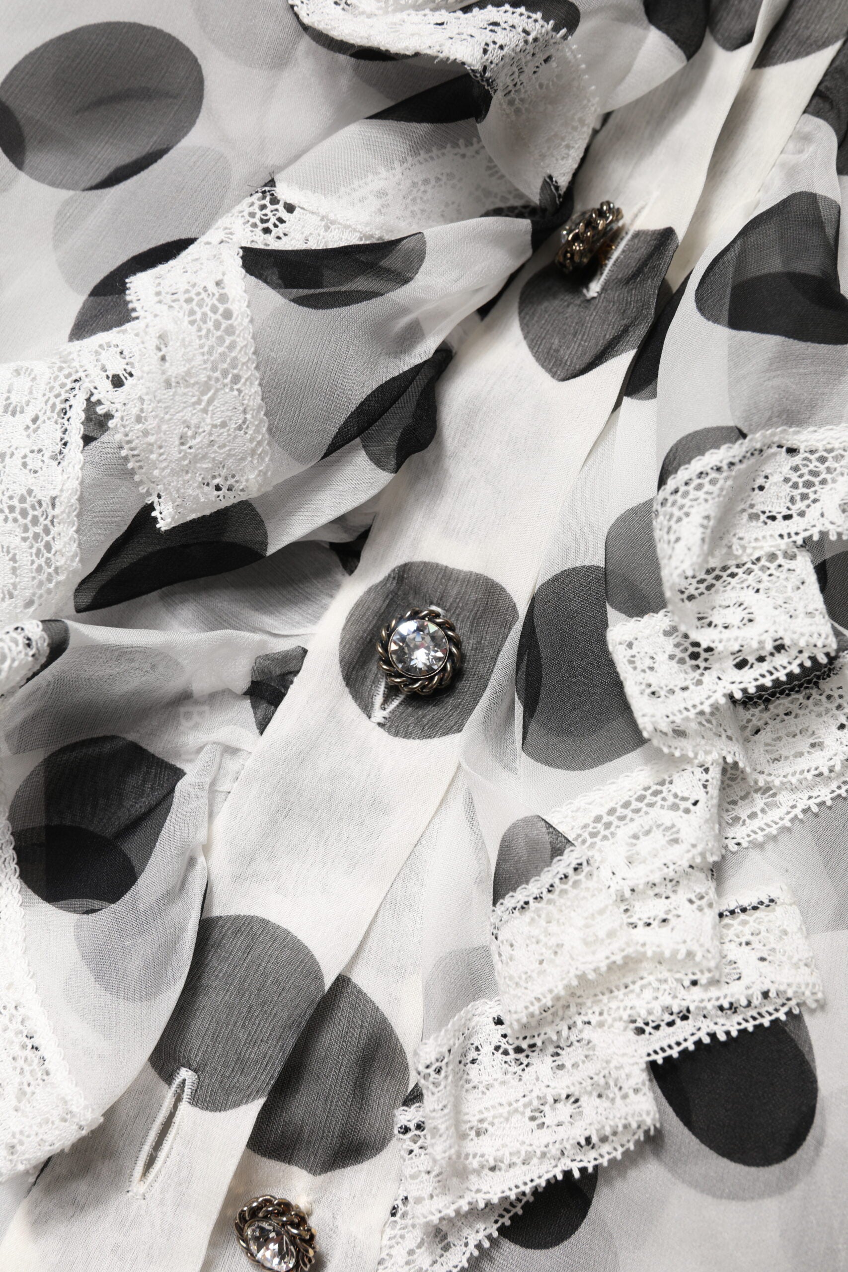 Haut sans manches en coton noir et blanc à pois de Dolce & Gabbana, style élégant et léger.