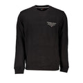 Sweatshirt homme en coton noir de la marque Tommy Hilfiger, avec logo discret sur la poitrine et col rond.