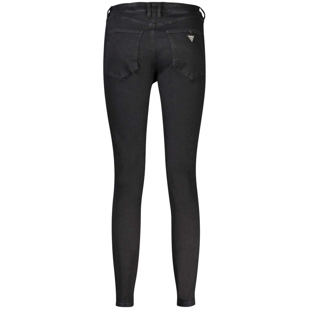 Jeans femme Guess en coton noir, coupe classique, détail de la ceinture et des poches visibles.