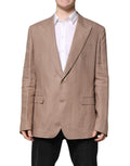 Manteau blazer beige à un bouton Dolce & Gabbana Taormina, coupe simple et élégante, porté sur un fond neutre.