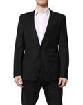 Costume blazer noir Dolce & Gabbana à boutonnière simple, ornement doré, coupe élégante pour homme.