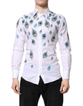 Chemise Dolce & Gabbana blanche en coton avec motif plumes et accents dorés, élégante chemise pour homme.