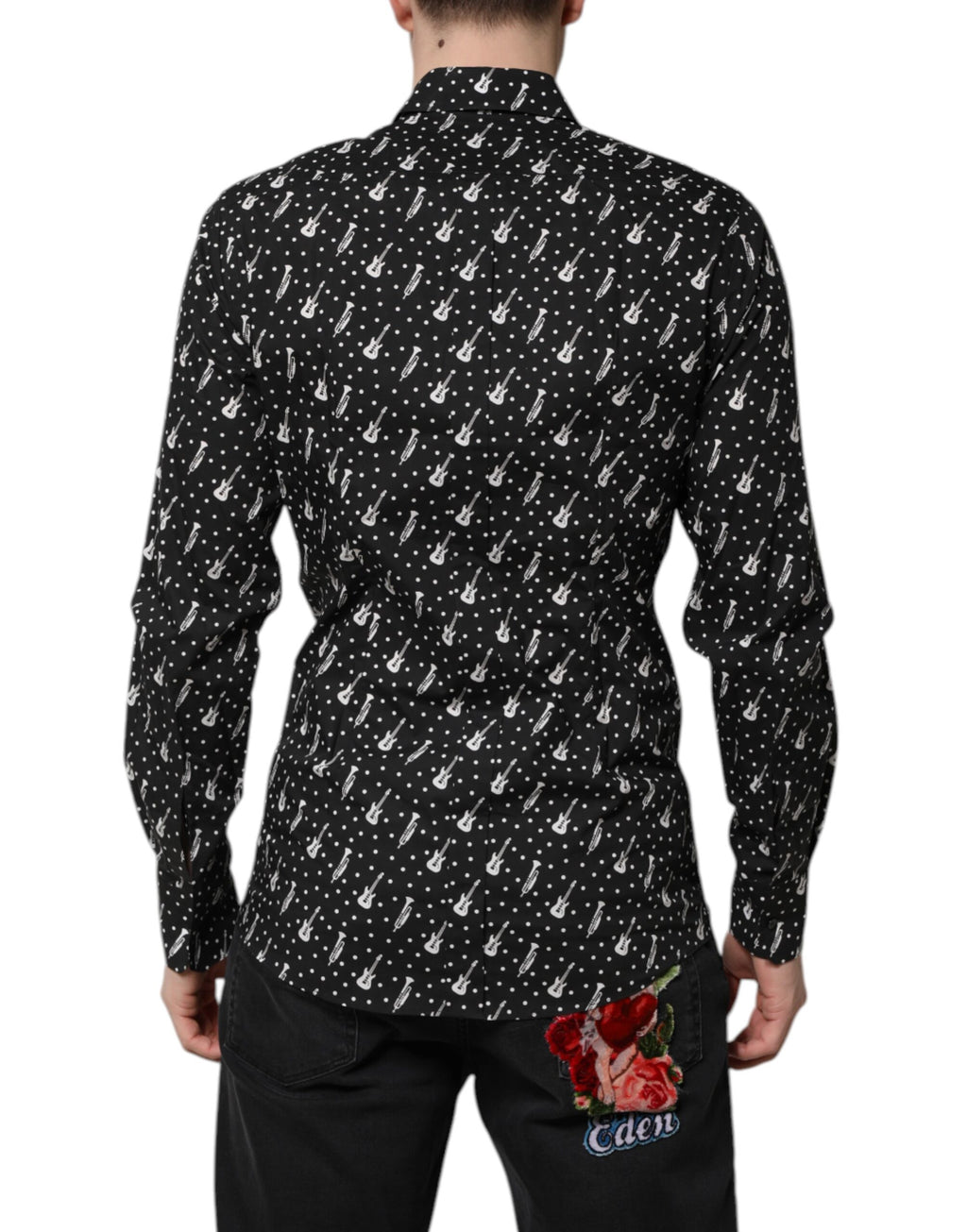 Chemise noire Dolce & Gabbana avec embellissements dorés et instruments, style élégant et sophistiqué.