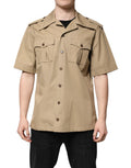 Chemise à manches courtes Dolce & Gabbana avec motif graphique marron, visible en gros plan sur le tissu et le design.