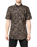 Chemise Dolce & Gabbana multicolore camouflage à boutons, style élégant avec détails dorés visibles.