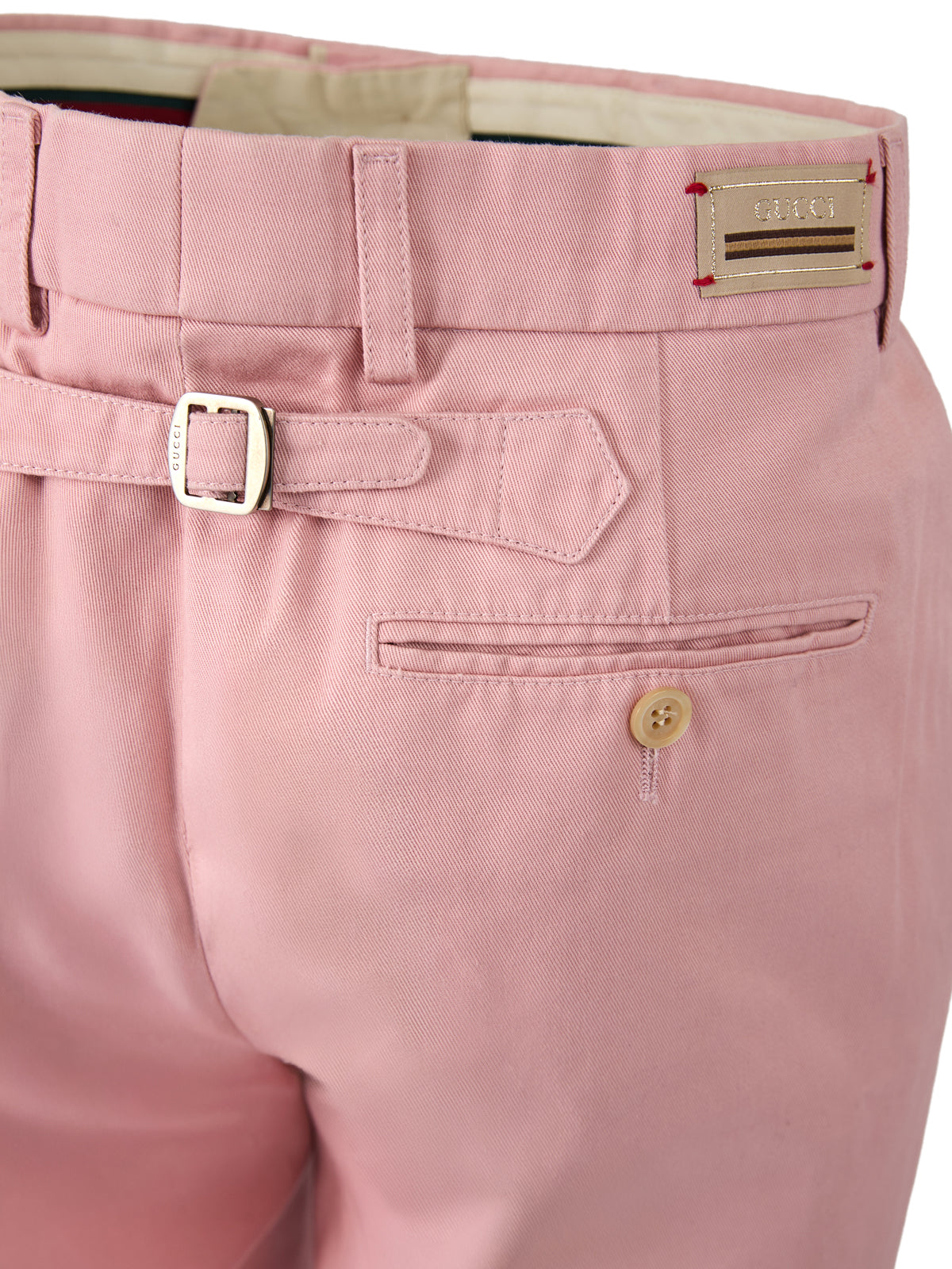 Pantalons en coton rose clair de Gucci, style décontracté avec coupe ajustée, visibles sur cette image.
