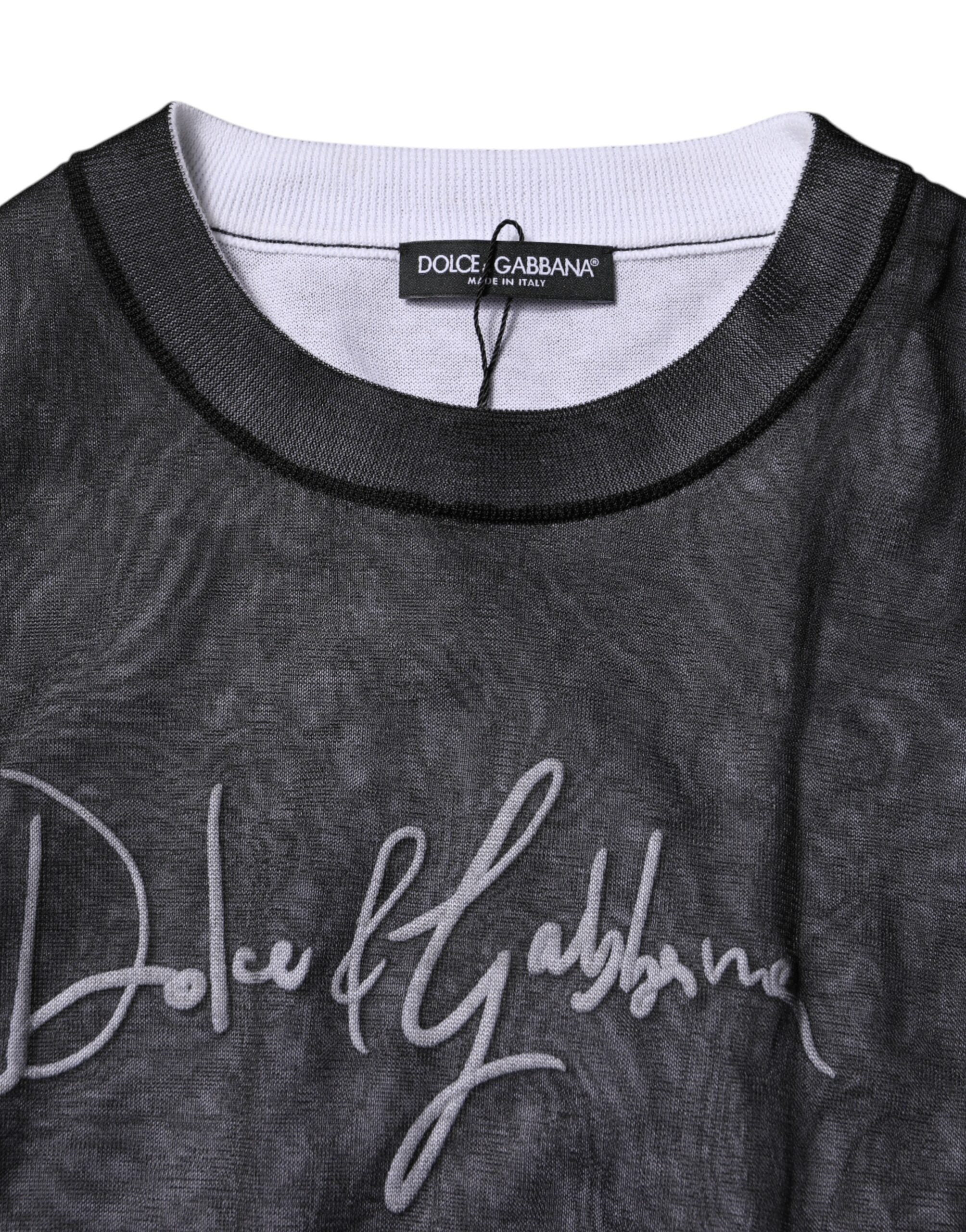 Pull à manches longues Dolce & Gabbana noir et blanc avec logo tricoté, style élégant et moderne.