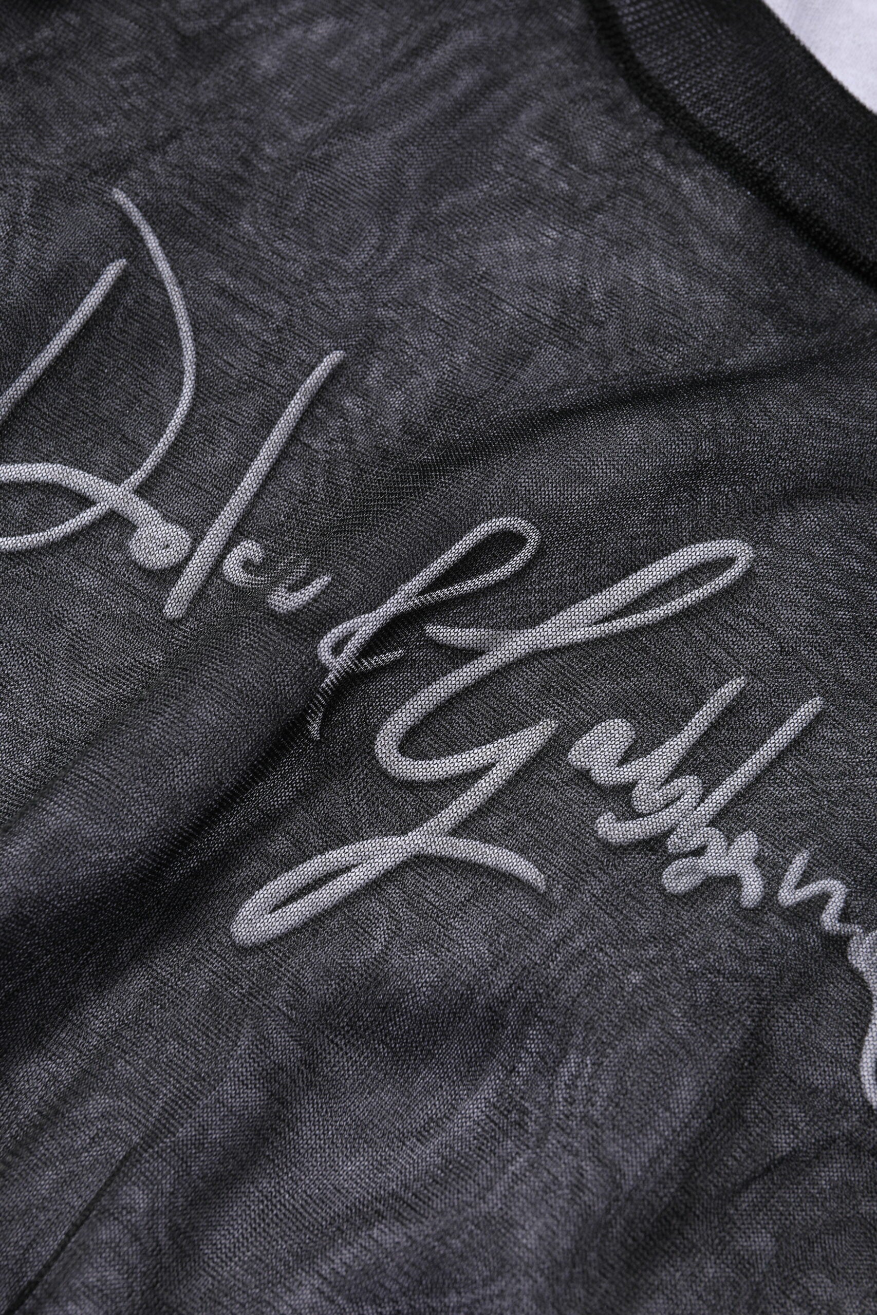 Pull à manches longues noir et blanc Dolce & Gabbana, en maille avec logo, style élégant et confortable.