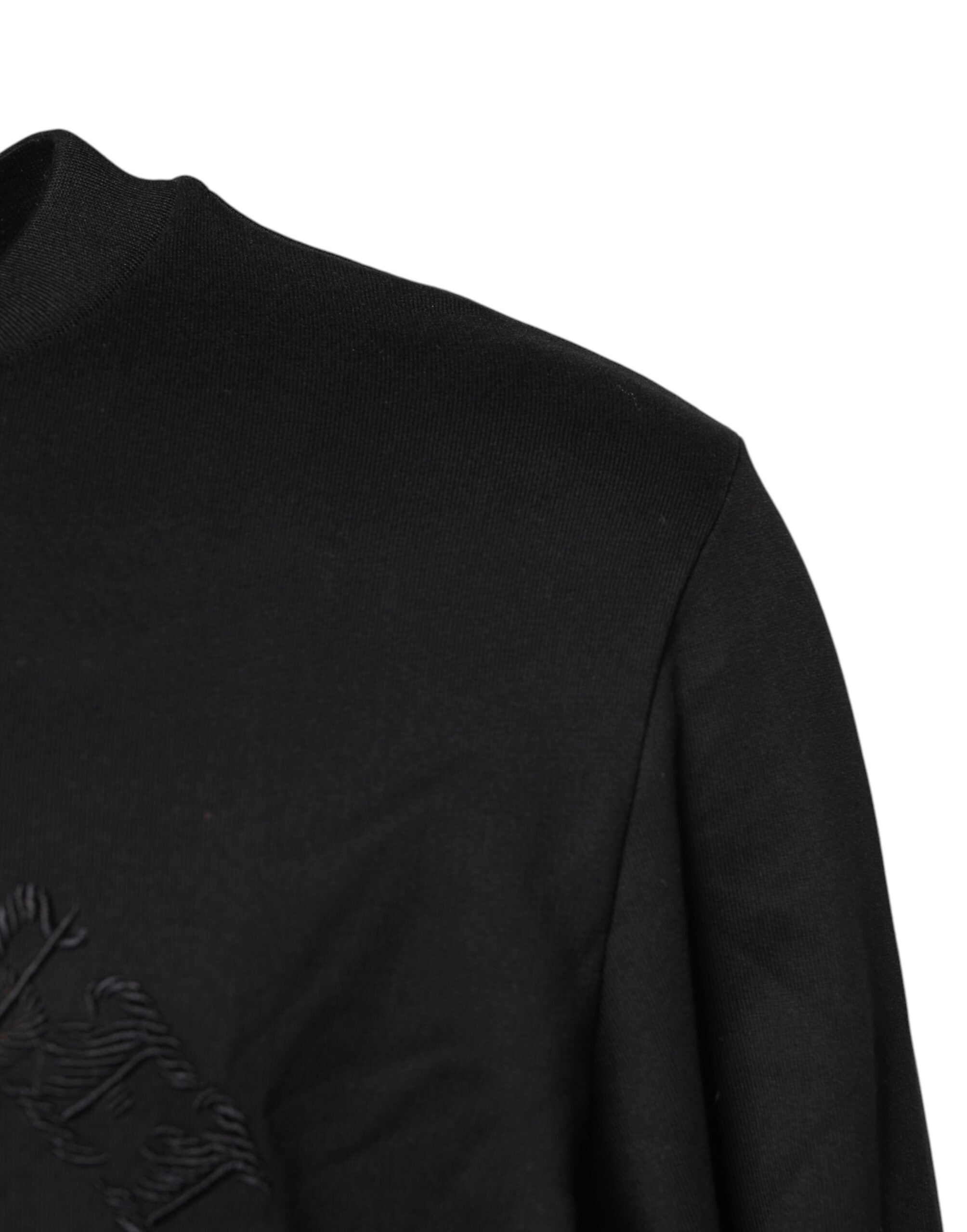 Pull en cachemire noir Dolce & Gabbana à col rond avec broderies élégantes visible sur l'image.