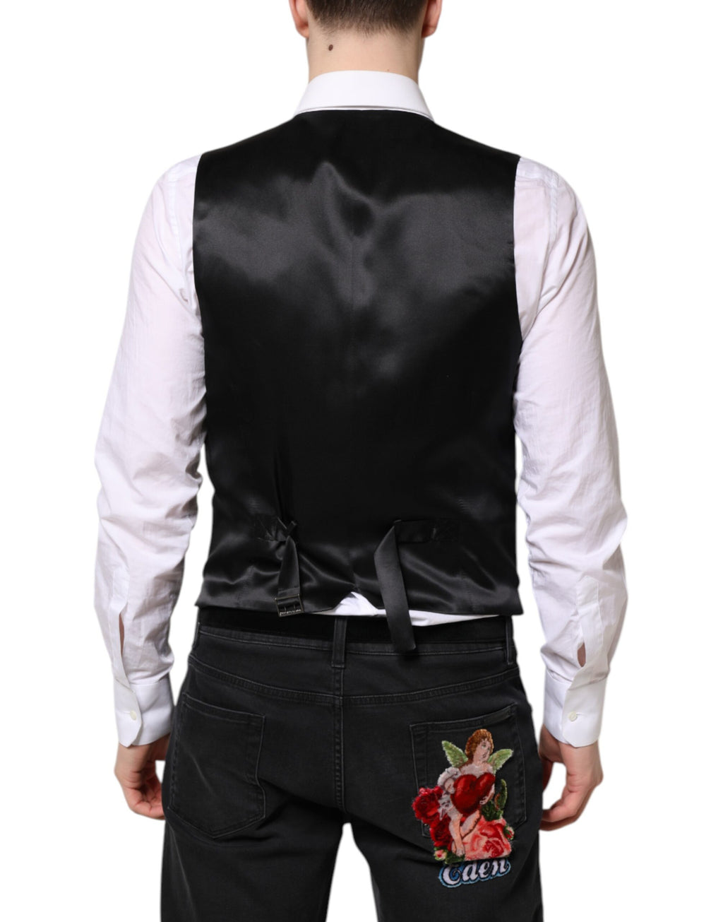 Gilet en laine noir Dolce & Gabbana, robe sans manches formelle, veste élégante pour femme, détail sophistiqué.