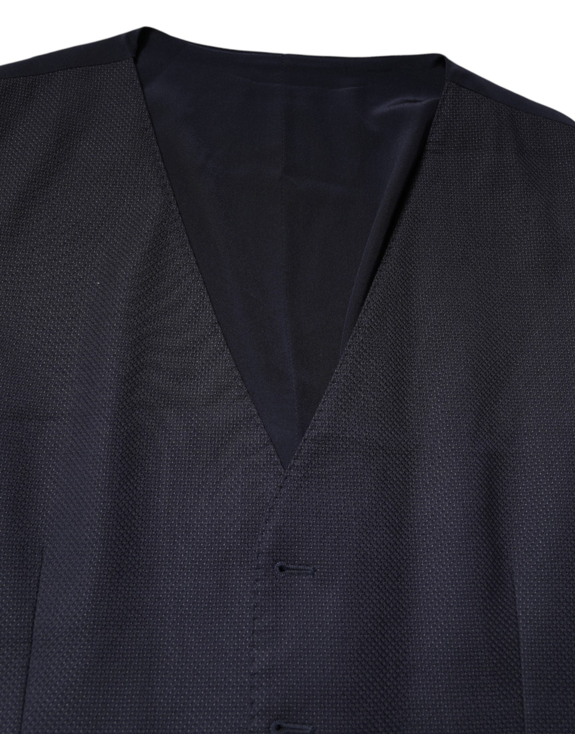Gilet formel en laine noire Dolce & Gabbana, robe sans manches élégante, détail sophistiqué pour tenue chic et élégante.