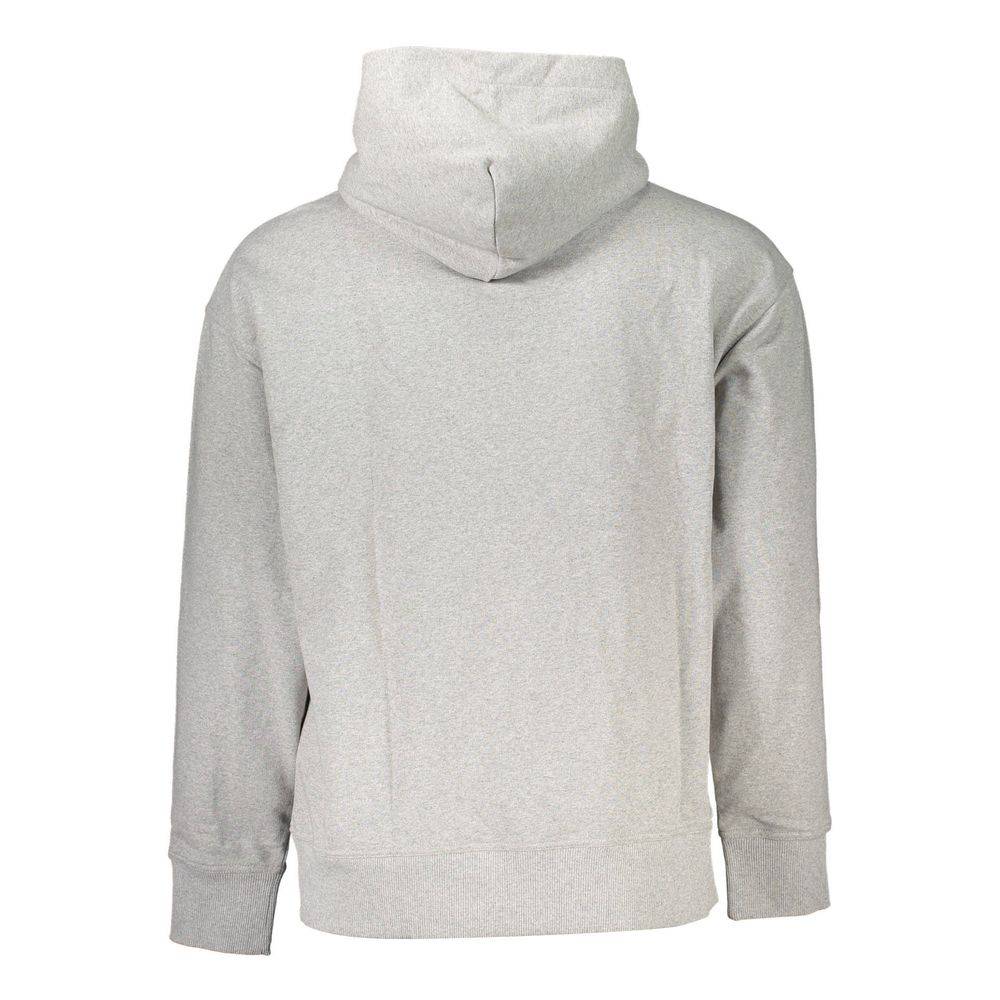 Pull en coton gris pour homme de Tommy Hilfiger, col rond, style décontracté et confortable, visible sur l'image.