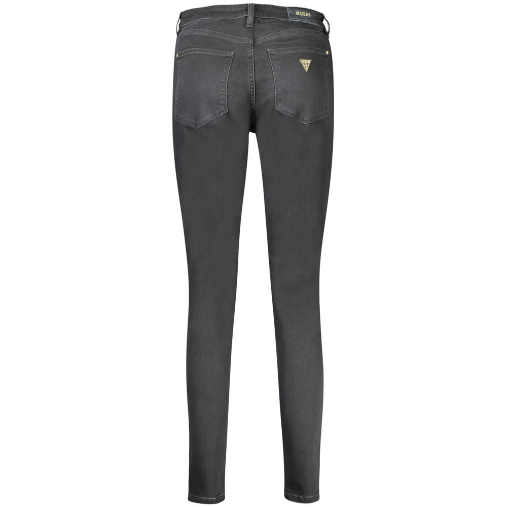Jean skinny en coton noir pour femme de la marque Guess Jeans, coupe ajustée et moderne, visible sur l'image.