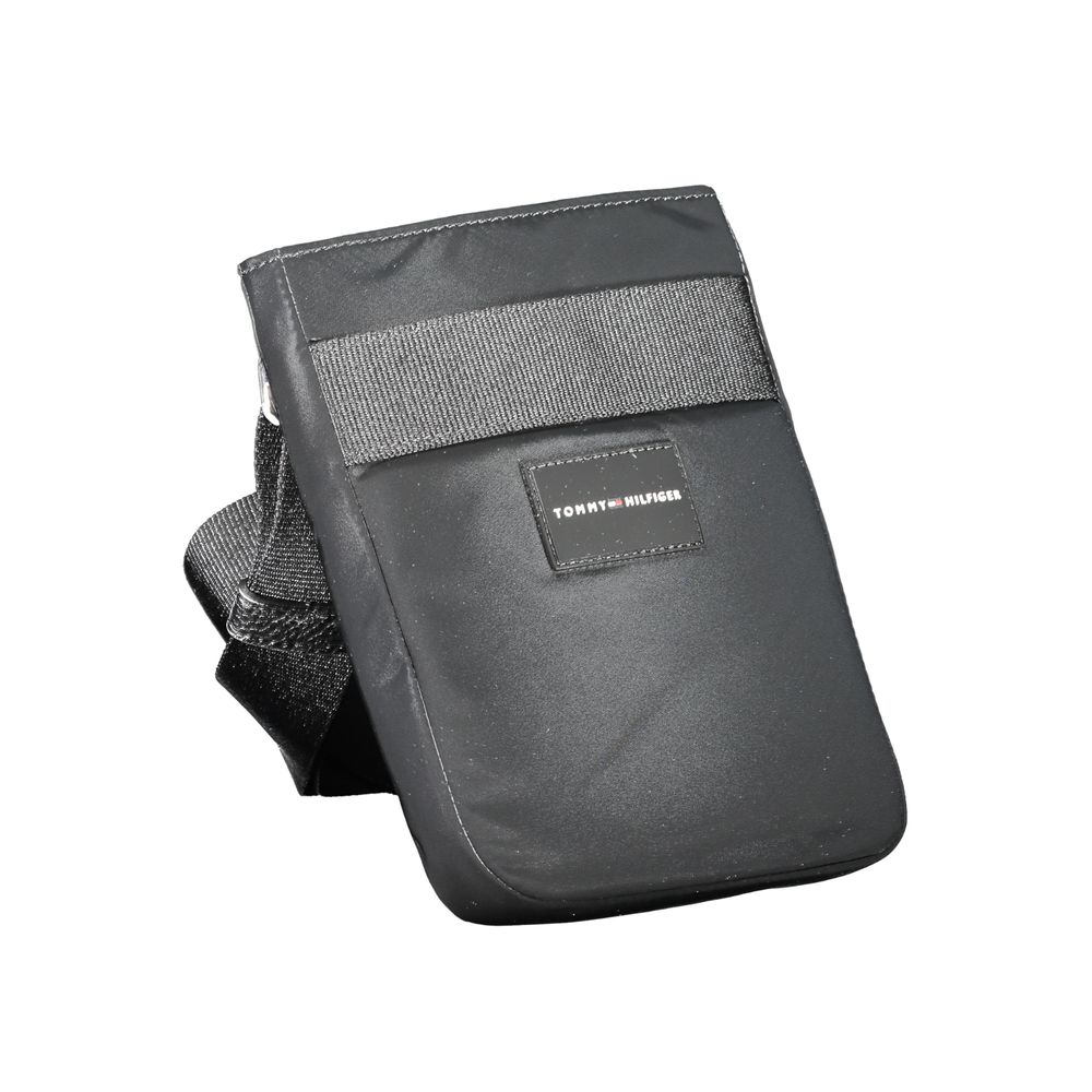 Sacoche homme Tommy Hilfiger en polyester noir, sac d'épaule élégant avec logo discret, idéal pour un style décontracté.