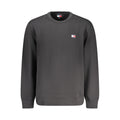Sweat-shirt homme en coton noir de Tommy Hilfiger, à col rond et logo discret sur la poitrine, porté sur un mannequin.