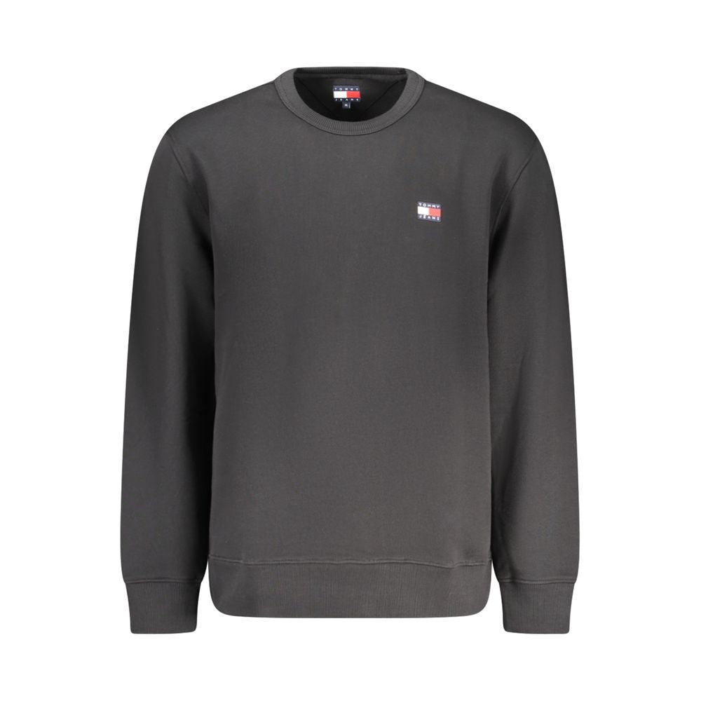 Sweat-shirt homme en coton noir de Tommy Hilfiger, à col rond et logo discret sur la poitrine, porté sur un mannequin.