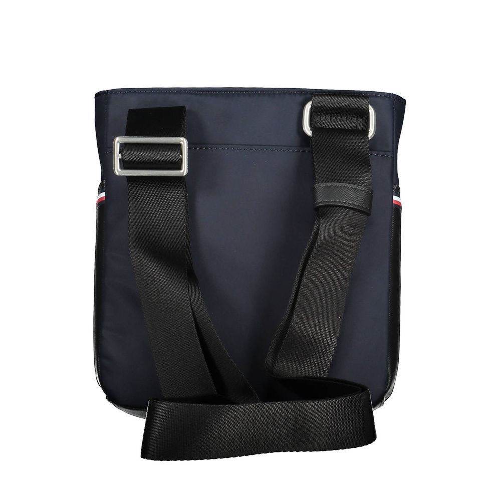 Sac à bandoulière en polyuréthane bleu pour homme de la marque Tommy Hilfiger, avec détails modernes et élégant design.