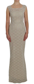 Robe fourreau en coton beige avec broderie et découpes, Dolce & Gabbana, élégante et sophistiquée.