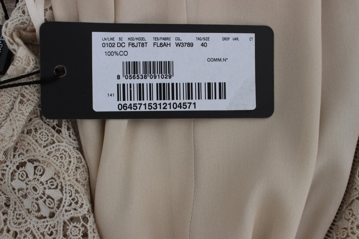Robe en coton beige Dolce & Gabbana Ricamo avec découpes, coupe ajustée, élégante et ornée de broderies sophistiquées.