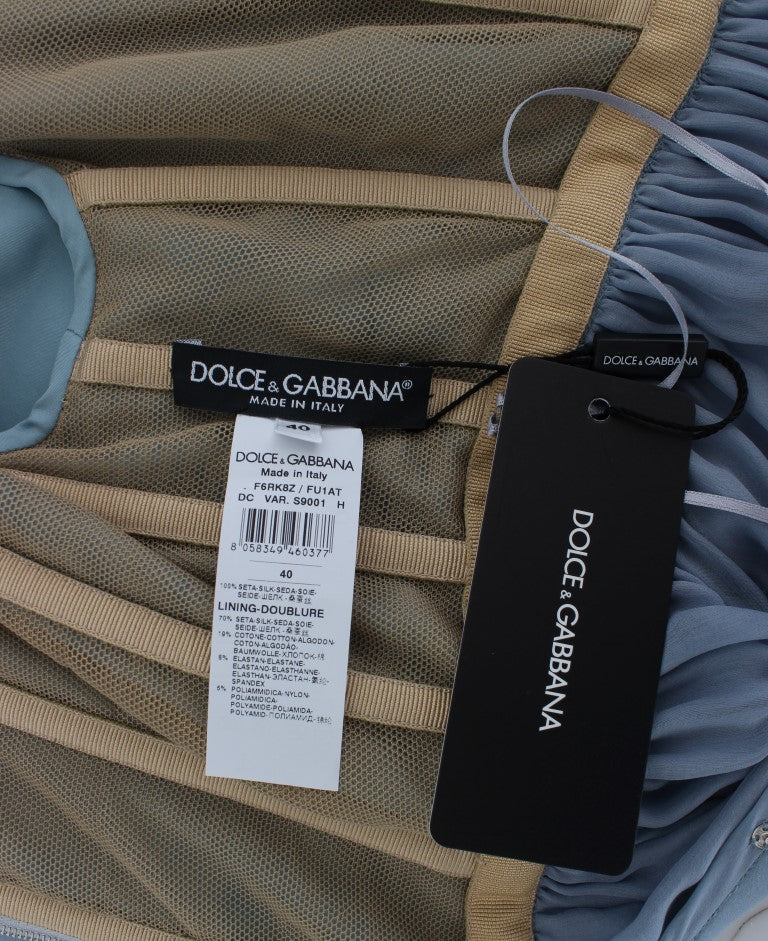 Robe de soirée en soie bleue Dolce & Gabbana avec cristaux, coupe ajustée et élégante, idéale pour un événement formel.