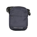 Sac homme Tommy Hilfiger en polyester recyclé bleu, sacoche d'épaule élégante avec logo de la marque visible.