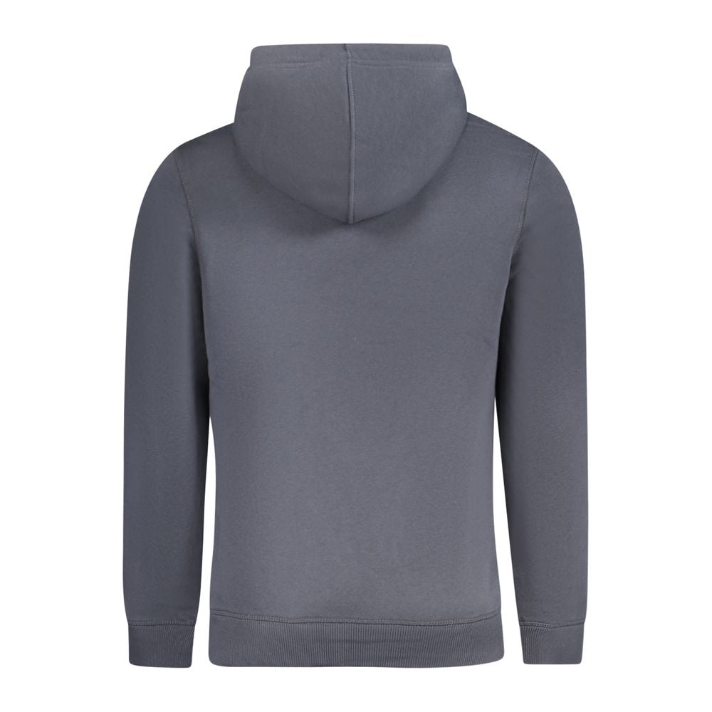 Sweatshirt homme en coton bleu Calvin Klein, coupe classique avec logo discret, porté sur un mannequin.