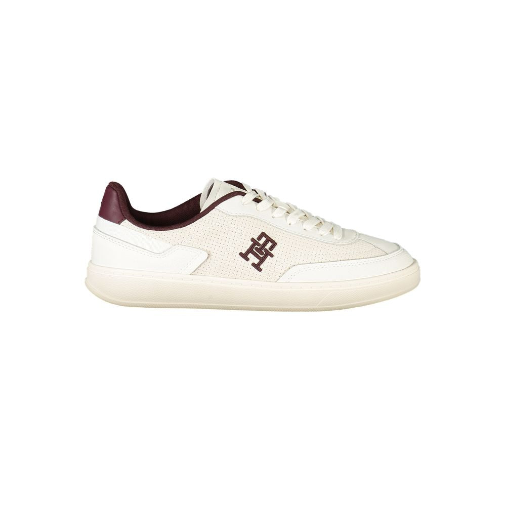Sneaker beige en polyuréthane pour femmes de la marque Tommy Hilfiger, vue de côté, avec semelle blanche.